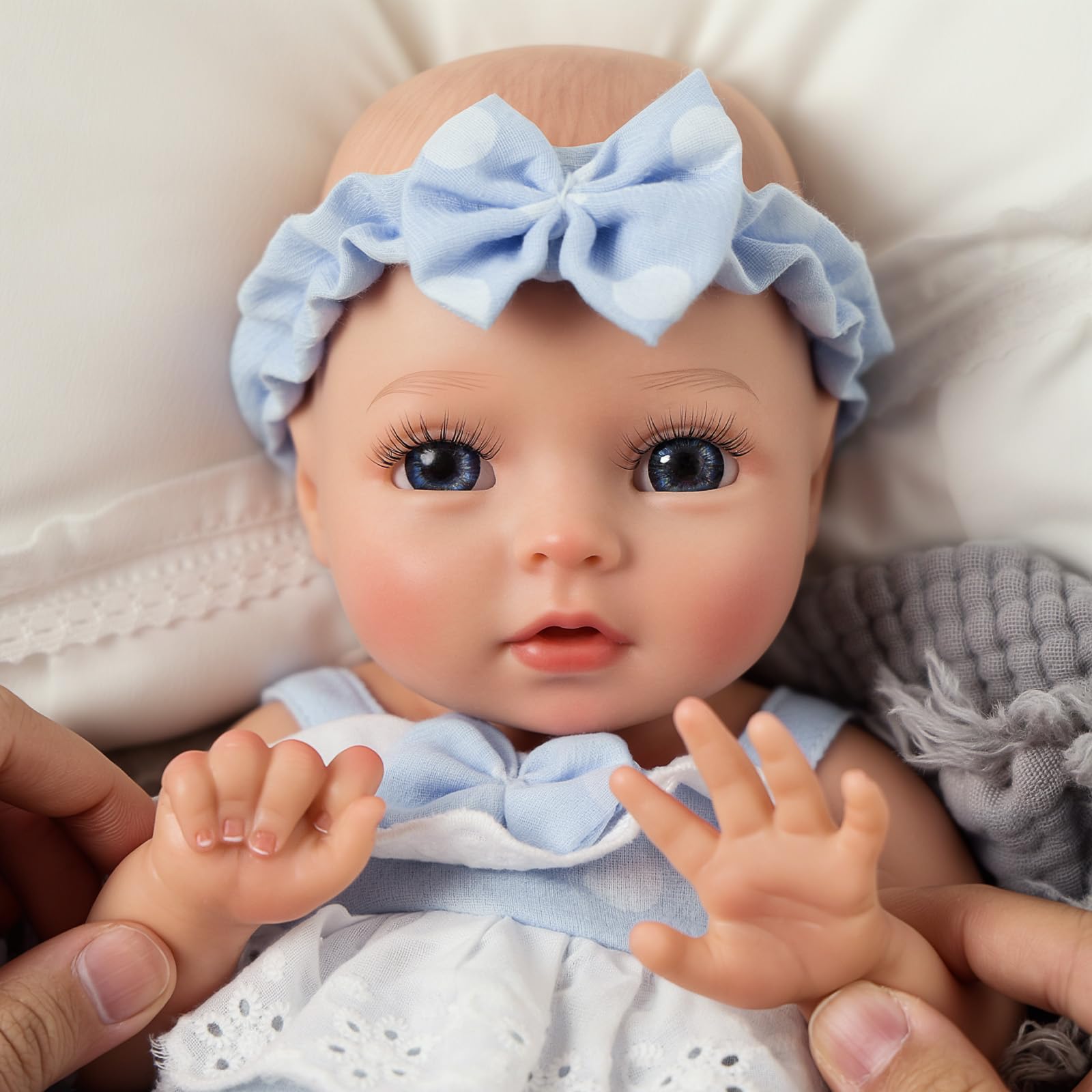 BABESIDE Terry hand and feet detail, authentic newborn-like features.