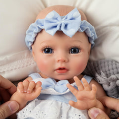 BABESIDE Terry hand and feet detail, authentic newborn-like features.