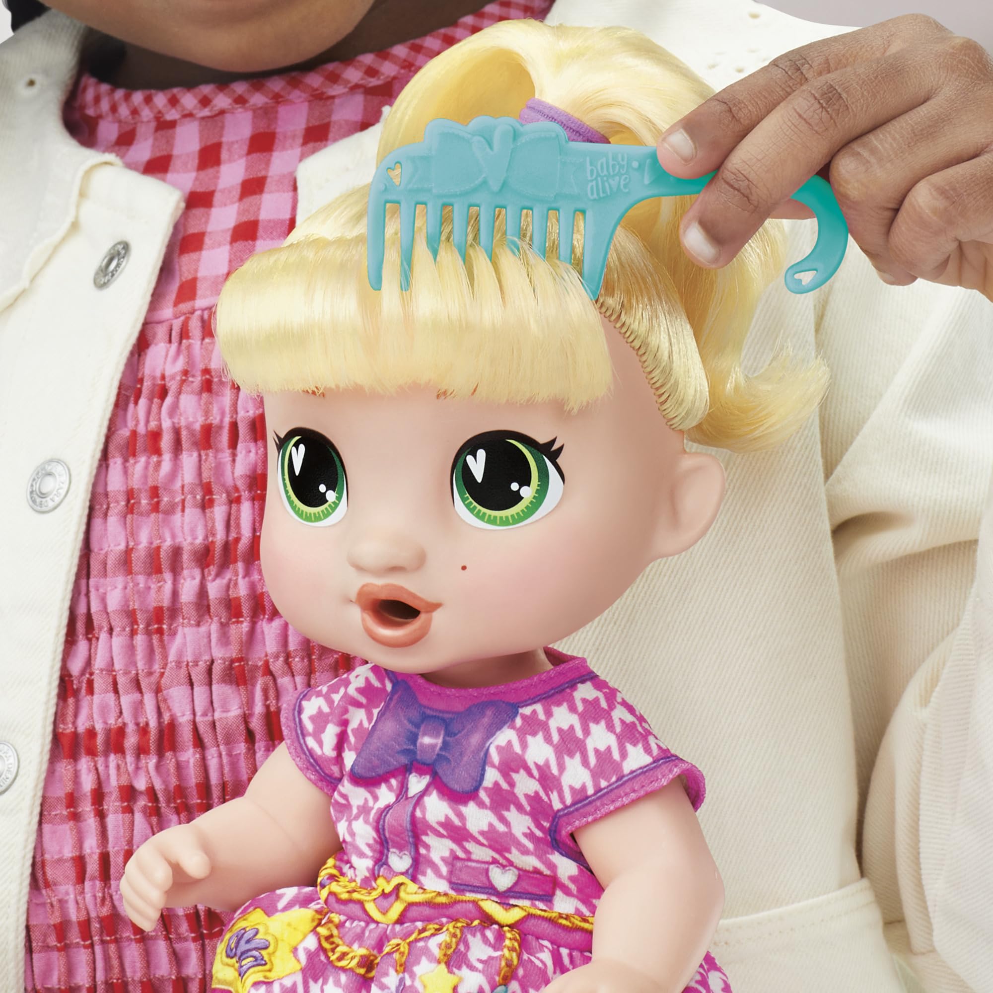 Baby Alive hairbrush helps style LaLa GooGoo’s hair.