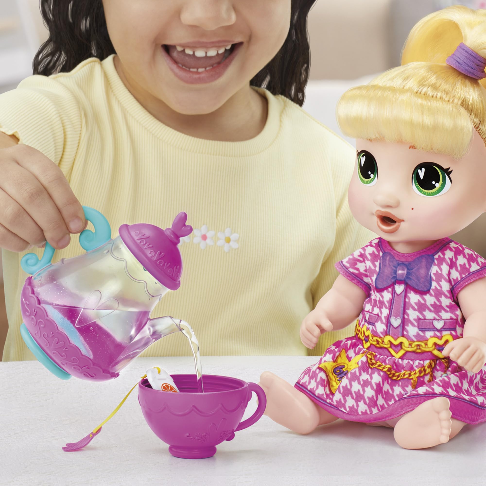 Baby Alive teabag in water enhances imaginative tea prep.