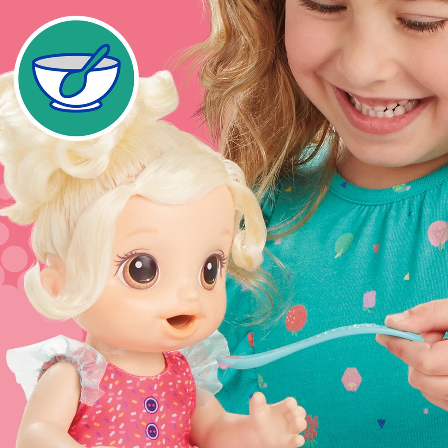 Baby Alive Magical Mixer Baby Doll being fed with spoon after mixing pretend strawberry treat