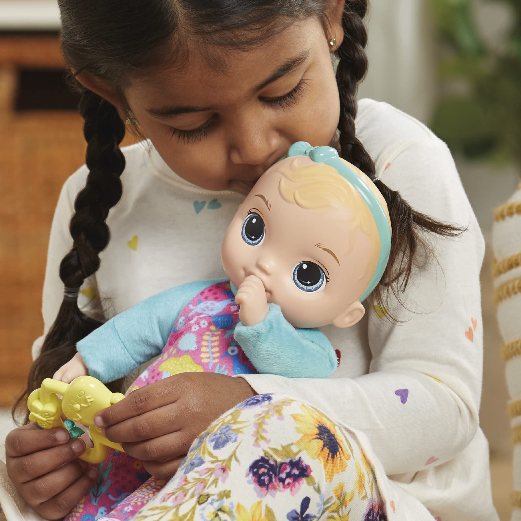Baby Alive doll posed with thumb in mouth for realistic baby moments