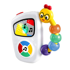 Baby Einstein Take Along Tunes toy held by small hands with an easy-grip button.