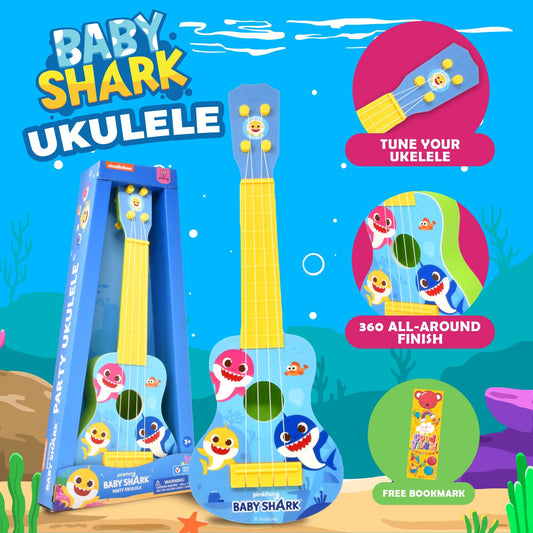 Child holds the Baby Shark ukulele showing kid-friendly size.