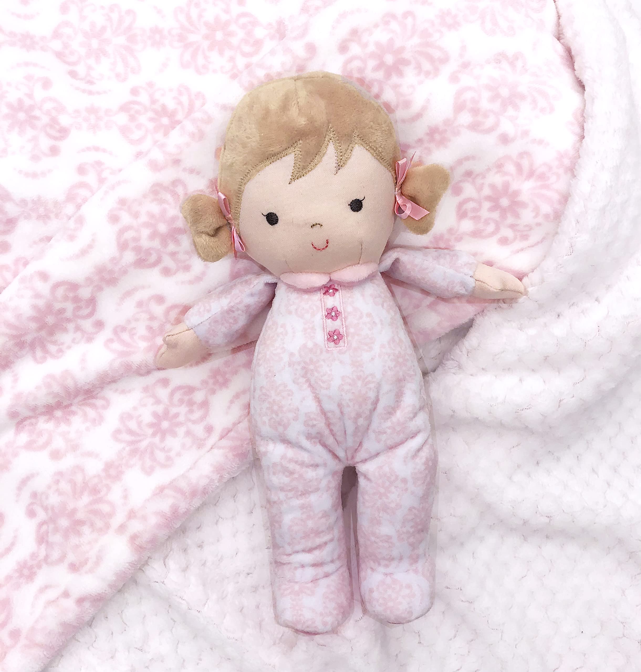 Brigitte pink bow detail enhances charm and grip for little hands