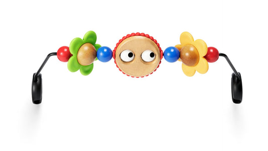 BabyBjörn Googly Eyes wooden toy on a bouncer for colorful stimulation