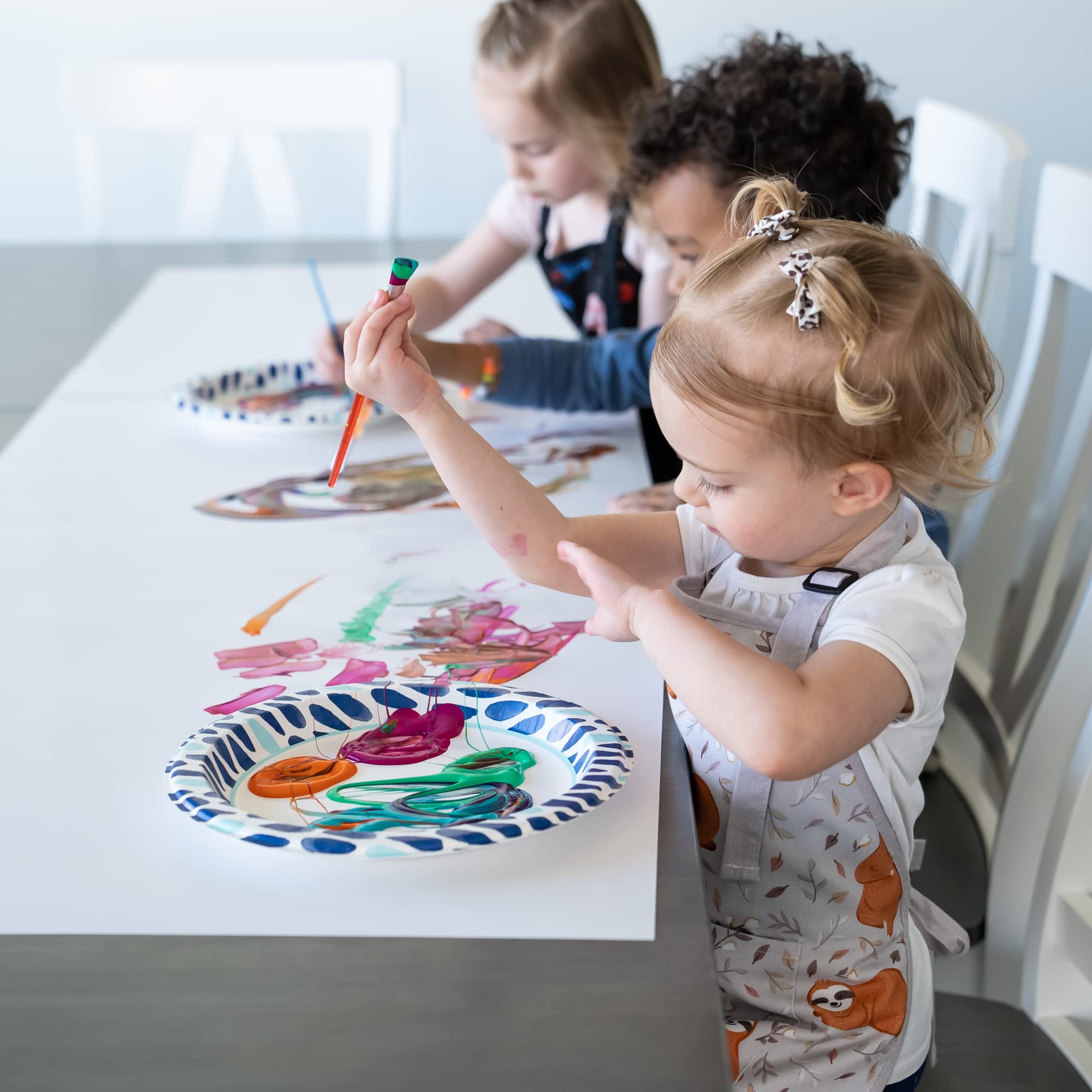 BABYBOET kids apron in use during painting to manage spills