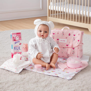 BABESIDE doll changing pad provides a clean care surface.