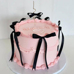 Bach and Boujee black bow cake topper adds dramatic contrast to celebration desserts.