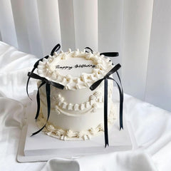 Bach and Boujee reusable black bow cake topper for weddings and birthdays.