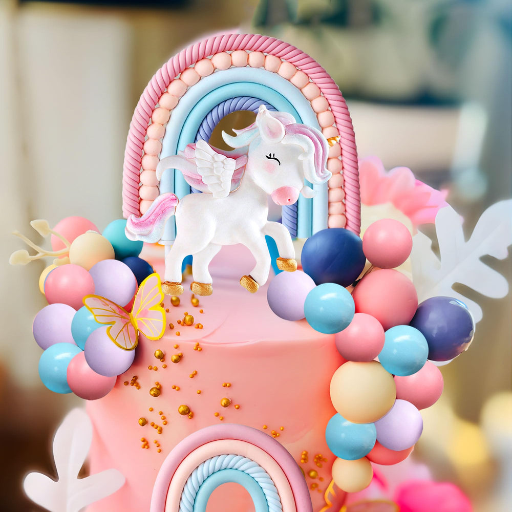 Bach and Boozy colorful rainbow toppers add playful accents to cakes