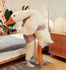 Bacmaze Goose Plush Doll in a child’s bedroom serves as a comforting bedtime companion.
