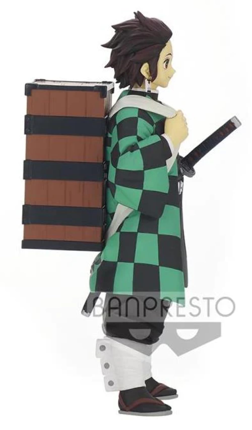 Banpresto Tanjiro dynamic pose captures action on desk.