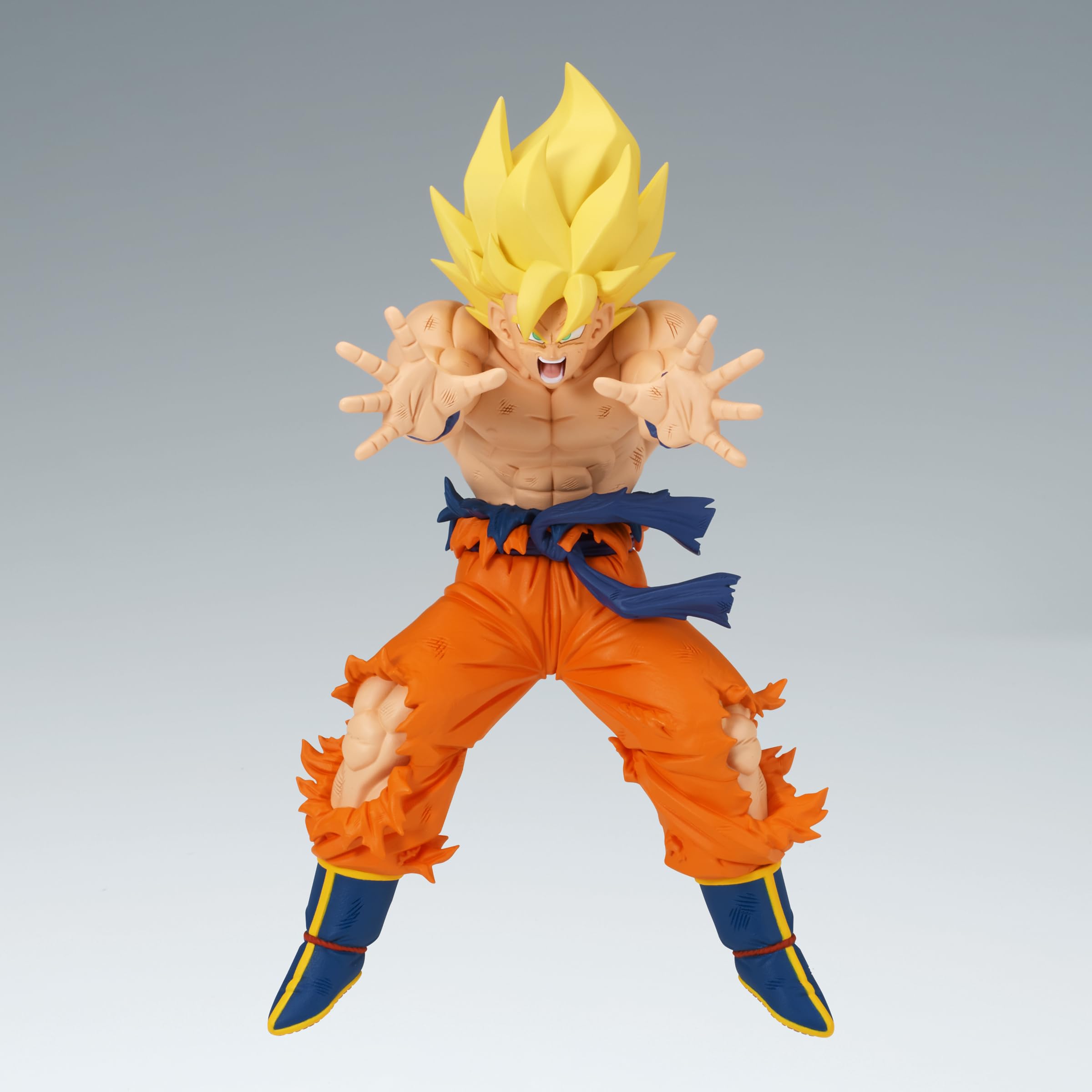 Goku in Super Saiyan pose with energy aura, ideal for diorama setups.