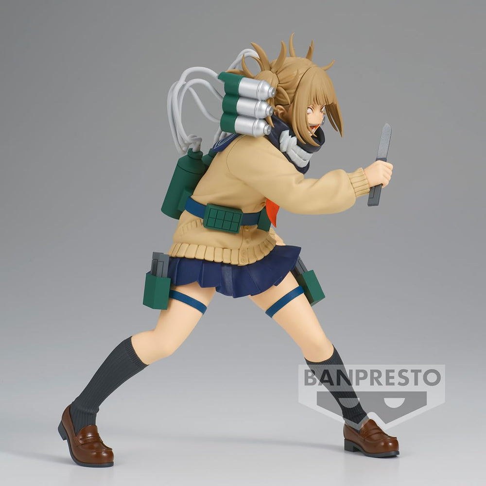 Display-ready Banpresto DX figure complements other collectibles on a shelf.