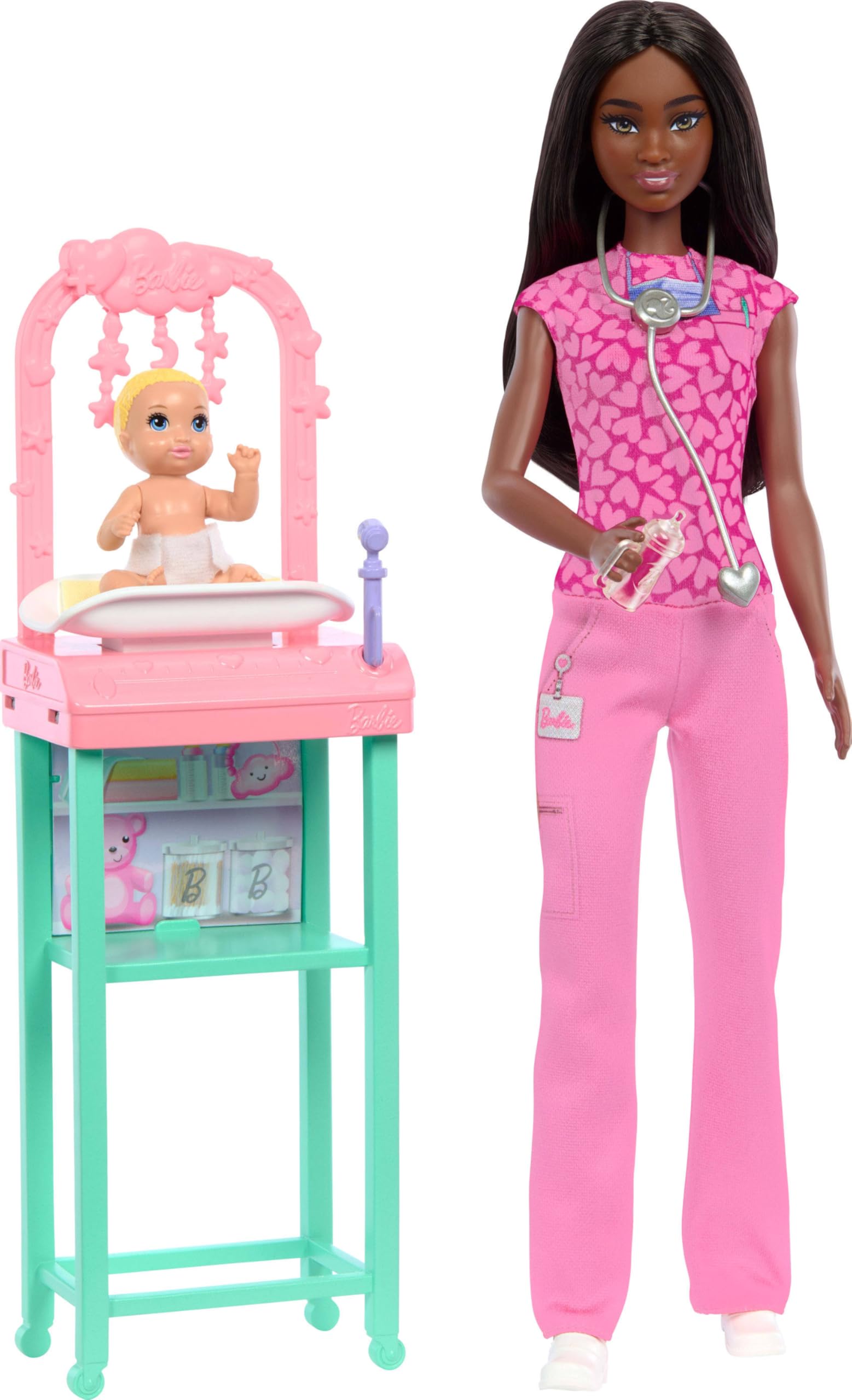 Barbie Baby Doctor Playset with brunette Barbie in pink scrubs and stethoscope for imaginative caregiving.