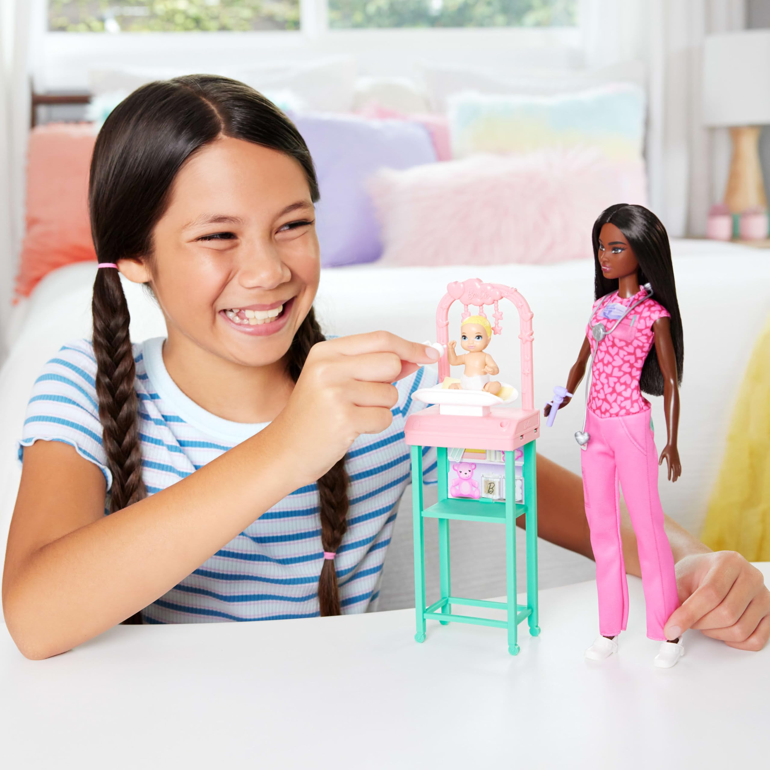 Barbie in pink scrubs with stethoscope ready for nurturing checkups and care.