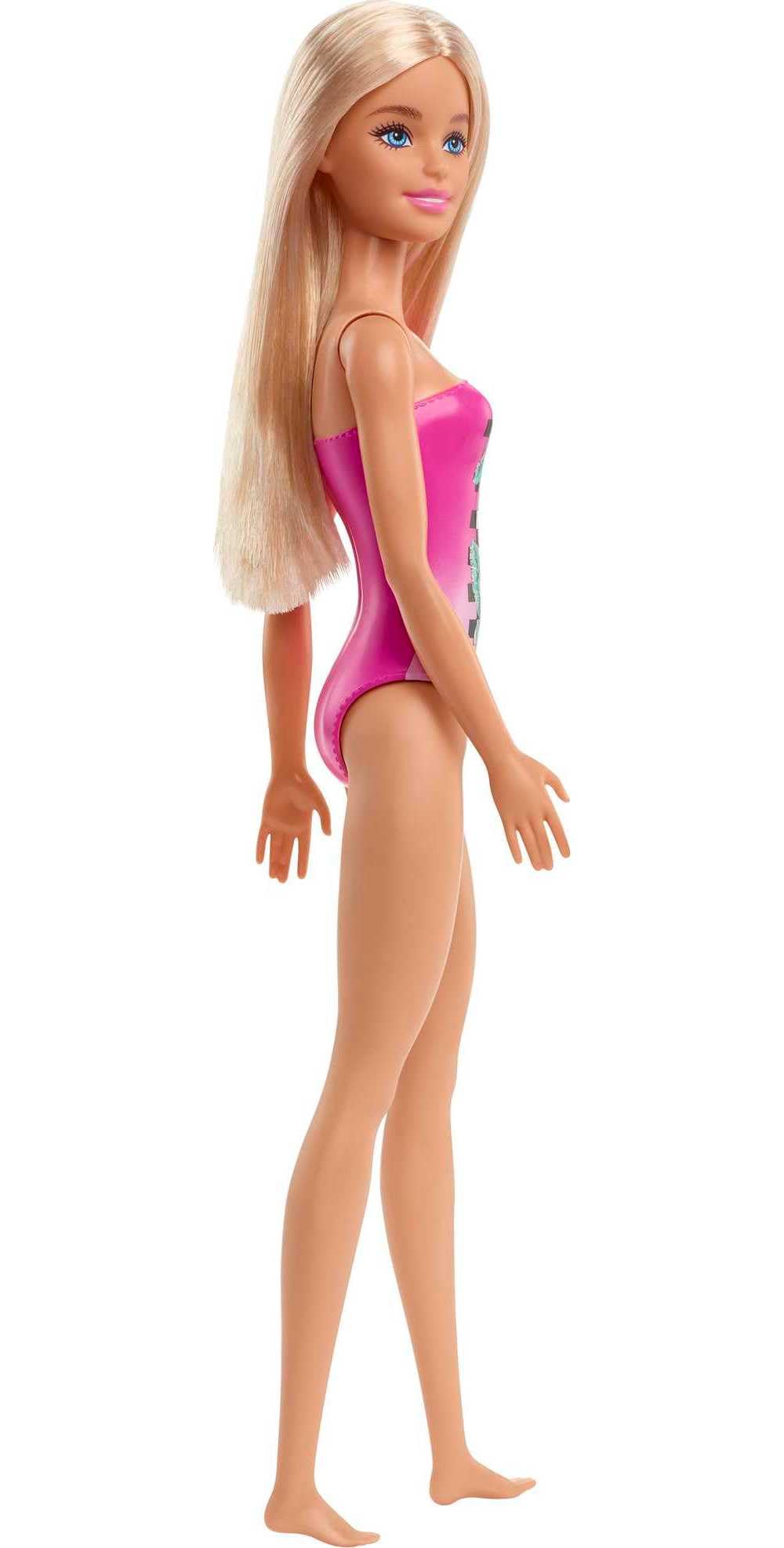 Barbie Beach Doll on sandy beach invites seaside adventures.