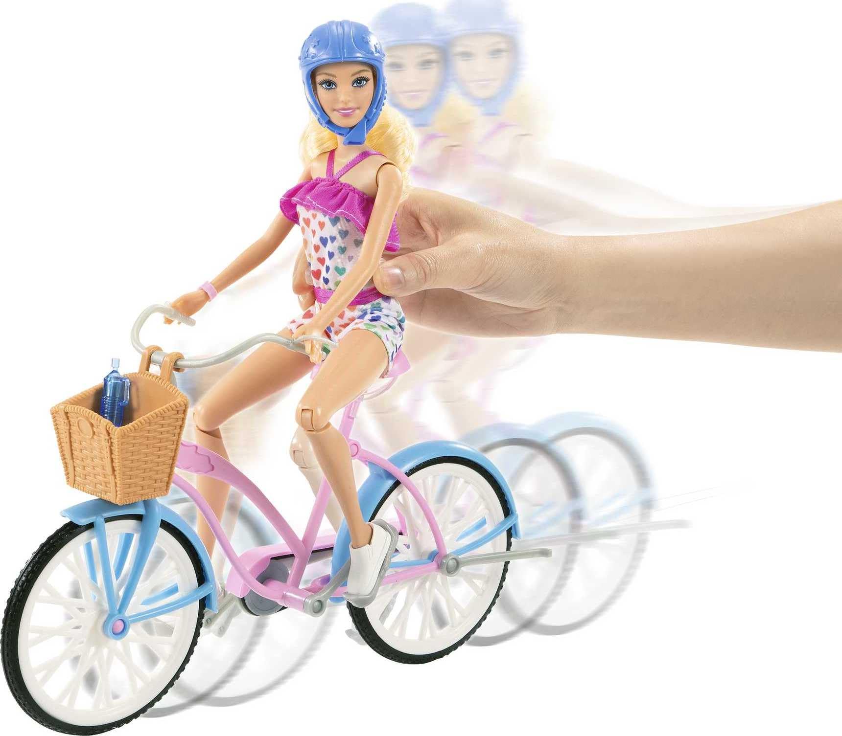 Barbie bike with rolling wheels and pedals for easy pretend rides.