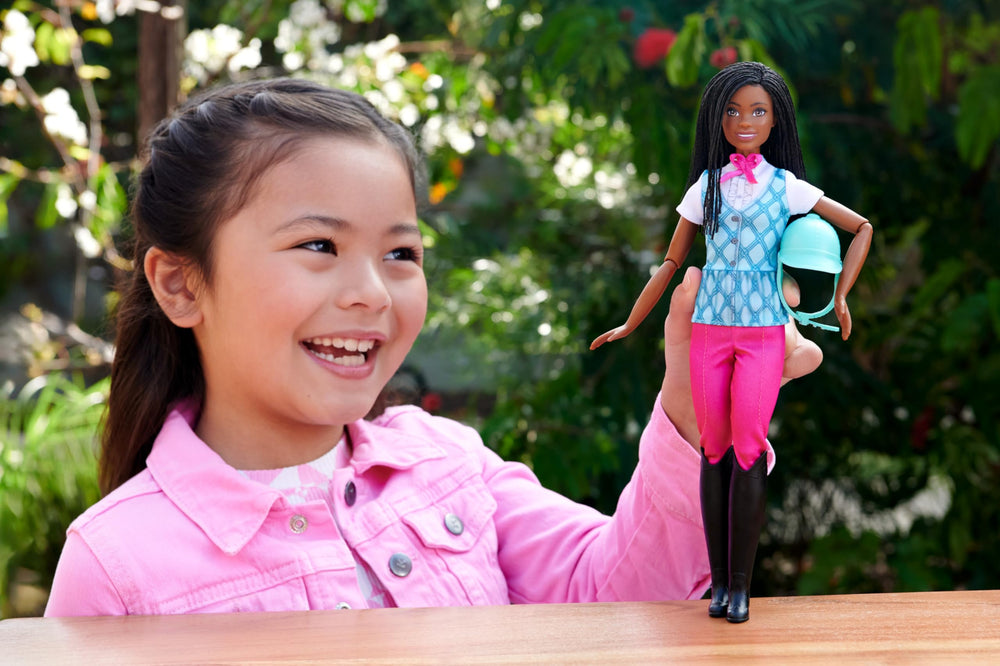 Barbie Brooklyn doll wearing helmet encourages safe, imaginative riding scenes.