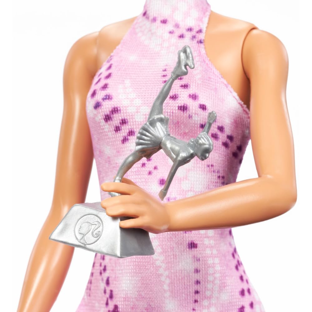 Barbie Careers brunette top bun highlights classic skating style.