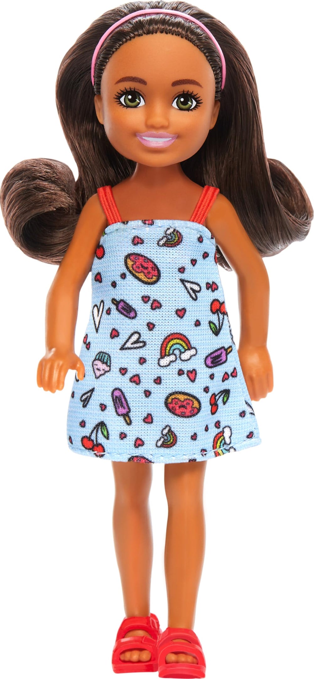 Barbie Chelsea doll in blue dress with colorful print for imaginative play.