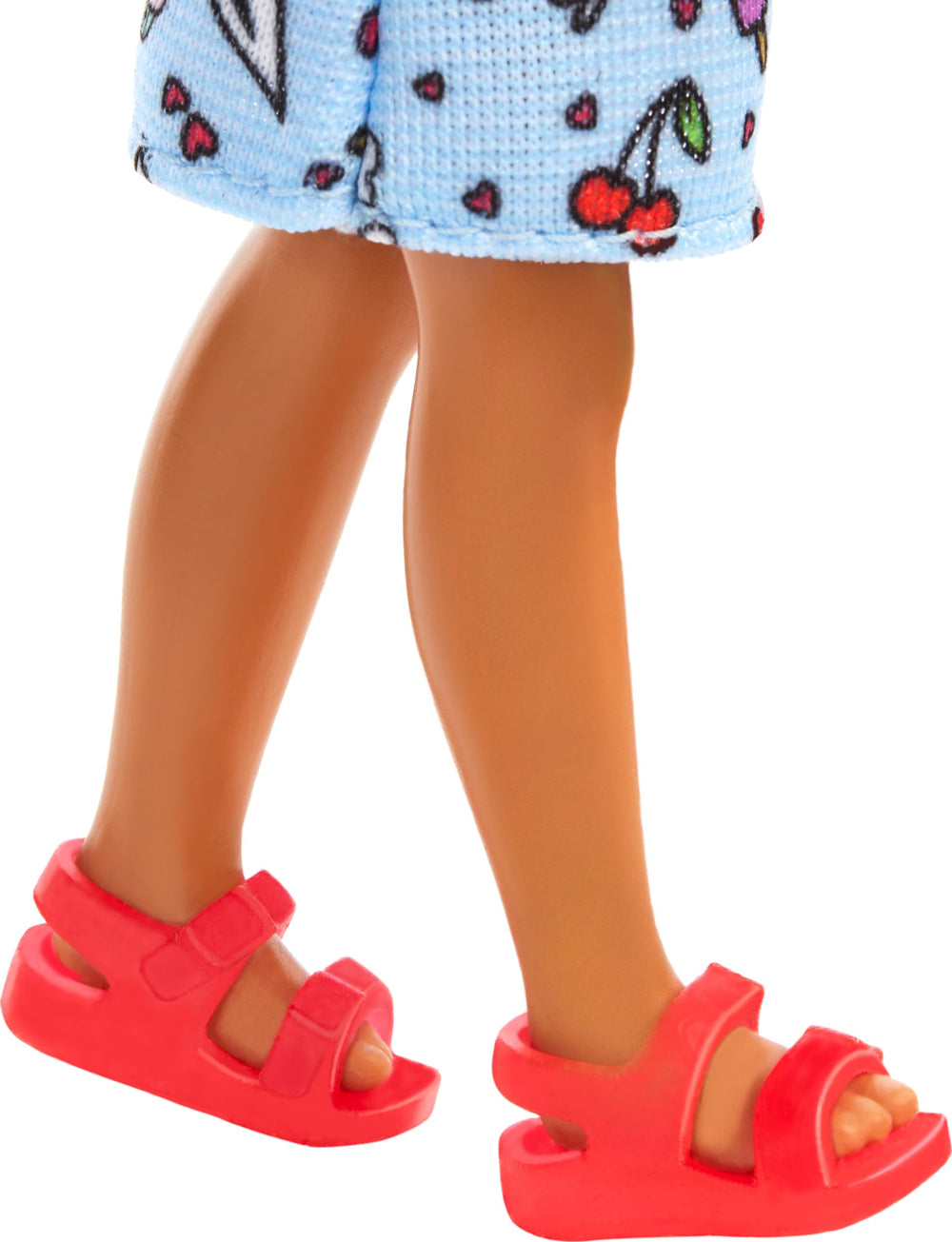 Barbie Chelsea doll wearing pink shoes for dress-up adventures.