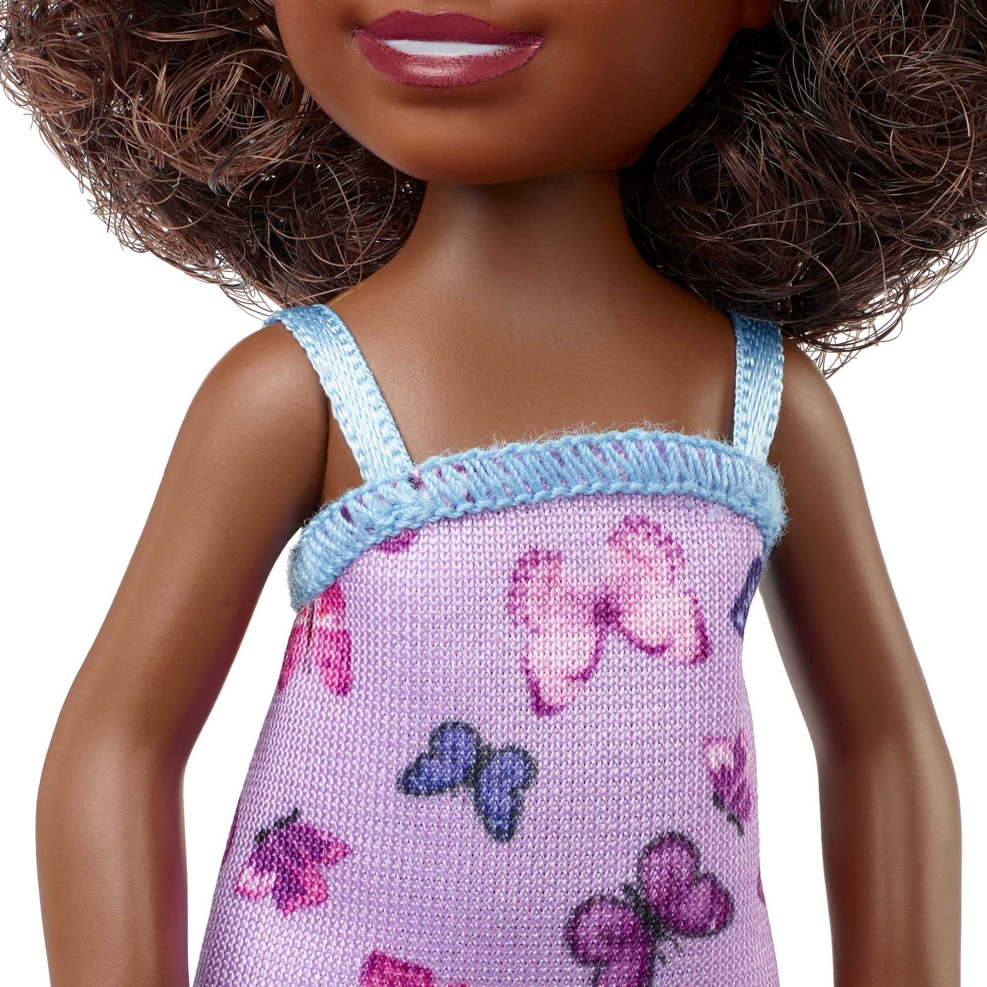 Barbie Chelsea doll shows pink sneakers perfect for playful adventures.