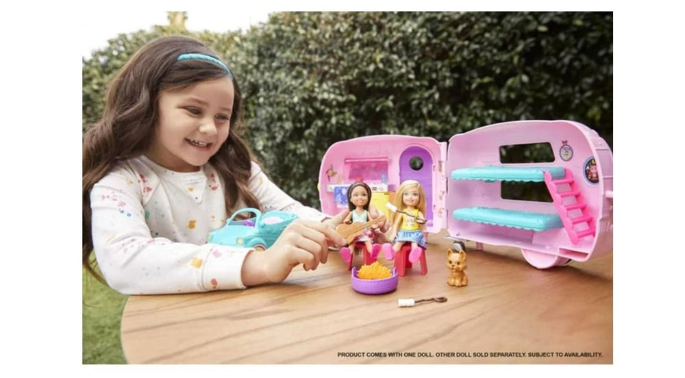 Barbie Chelsea doll in camper interior with outfits for storytelling.