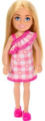 Barbie Chelsea doll wearing removable pink checkered dress for dress-up play.