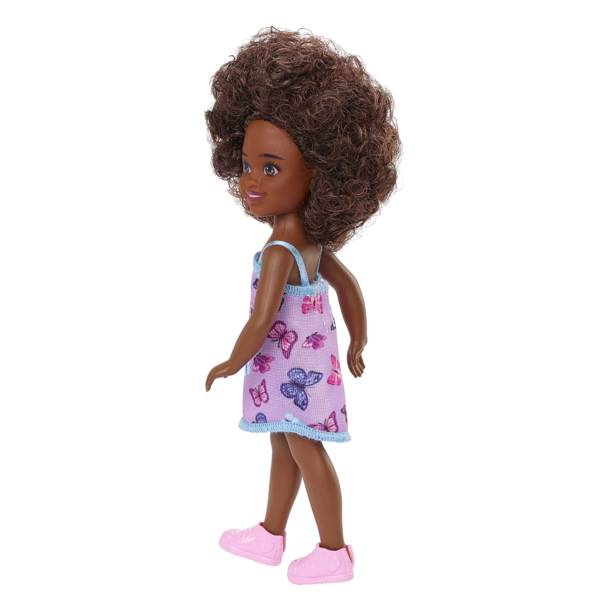 Barbie Chelsea doll removable fashion pieces expand dress-up play options.