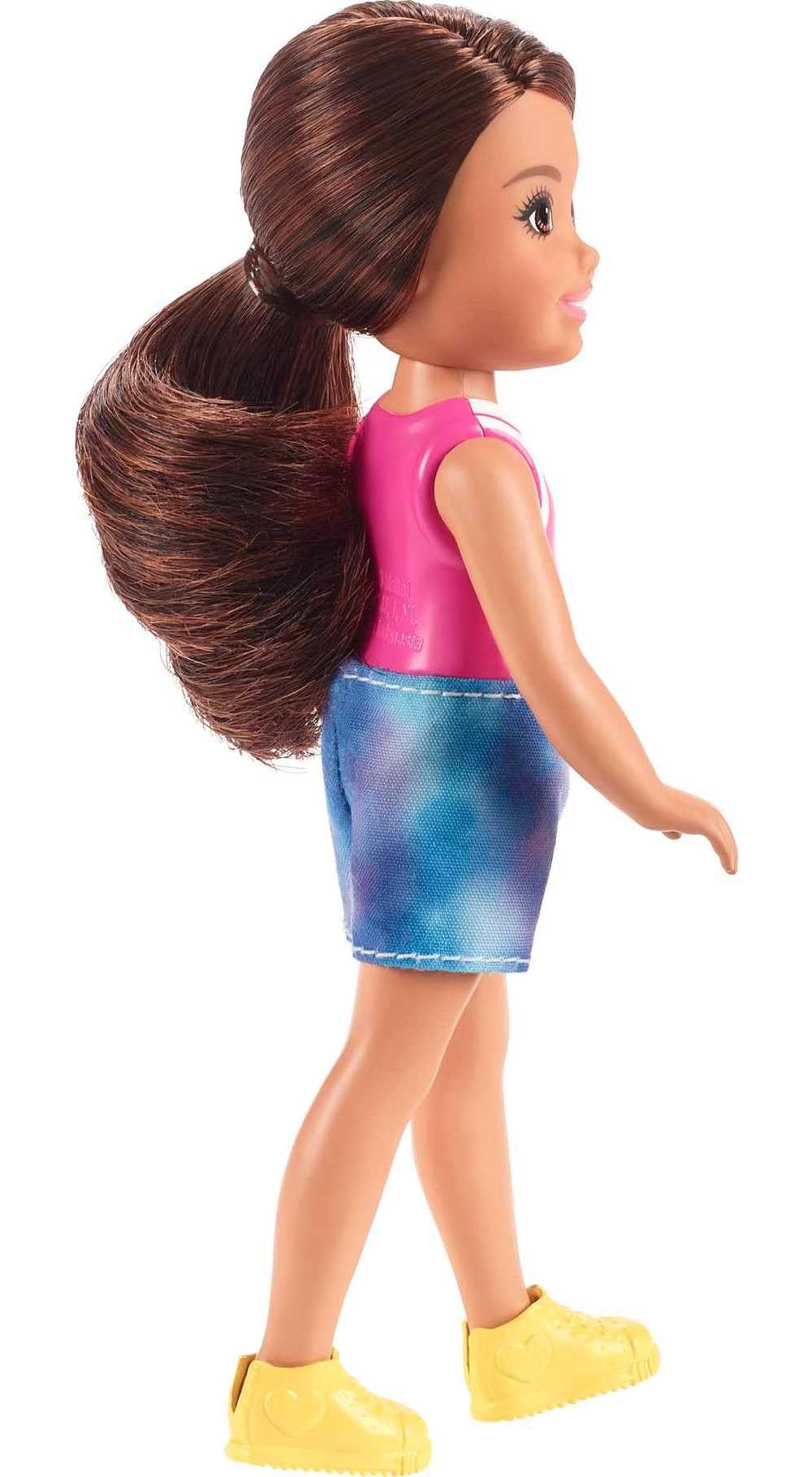 Barbie Chelsea doll features bright yellow shoes completing her outfit.