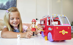Barbie Chelsea uses the rescue ladder on the fire truck for adventurous play