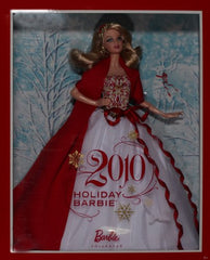 Barbie 2010 Holiday Doll with red and gold bodice, perfect for seasonal display collections.