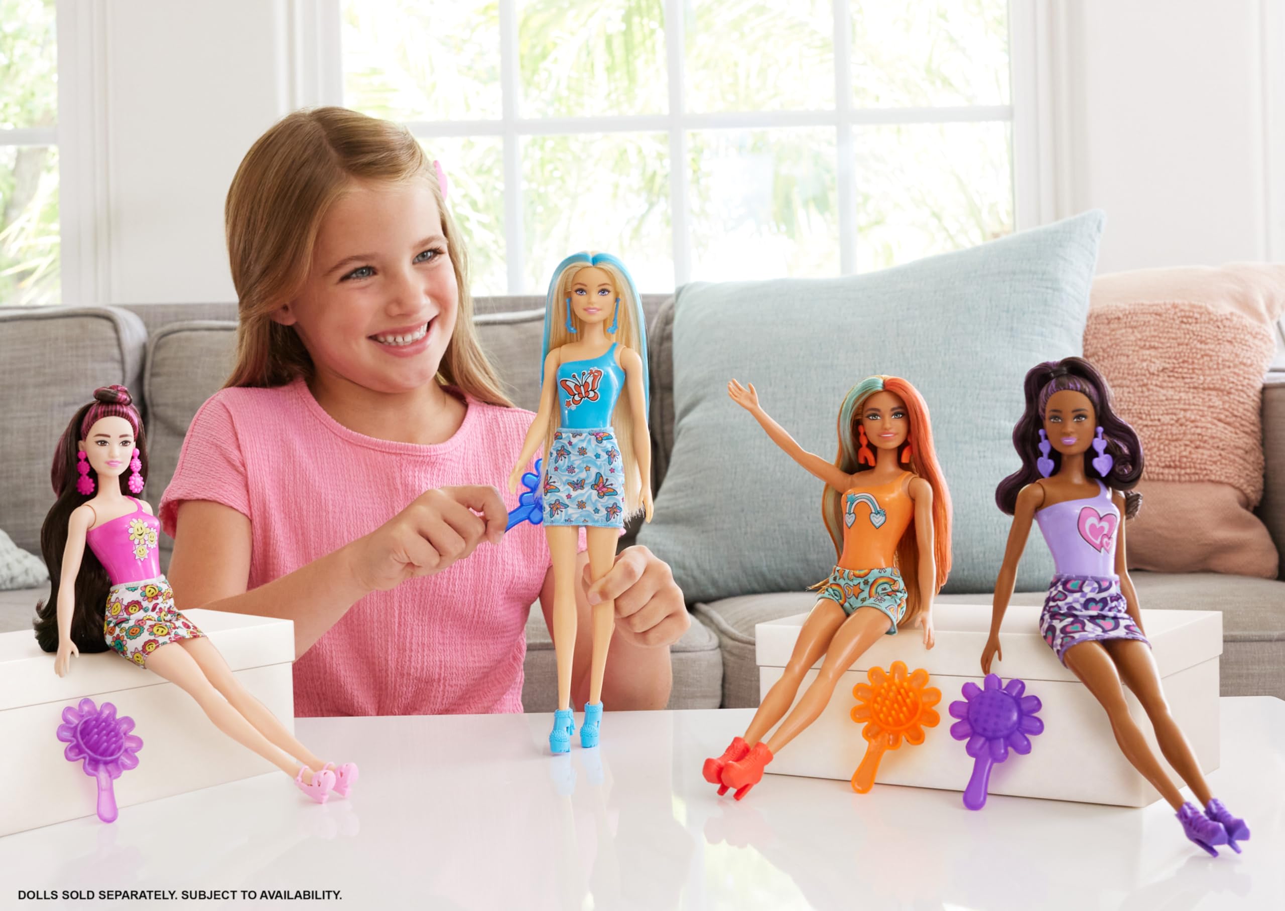 Barbie Color Reveal doll with pink coating, color-changing decal revealed by water.