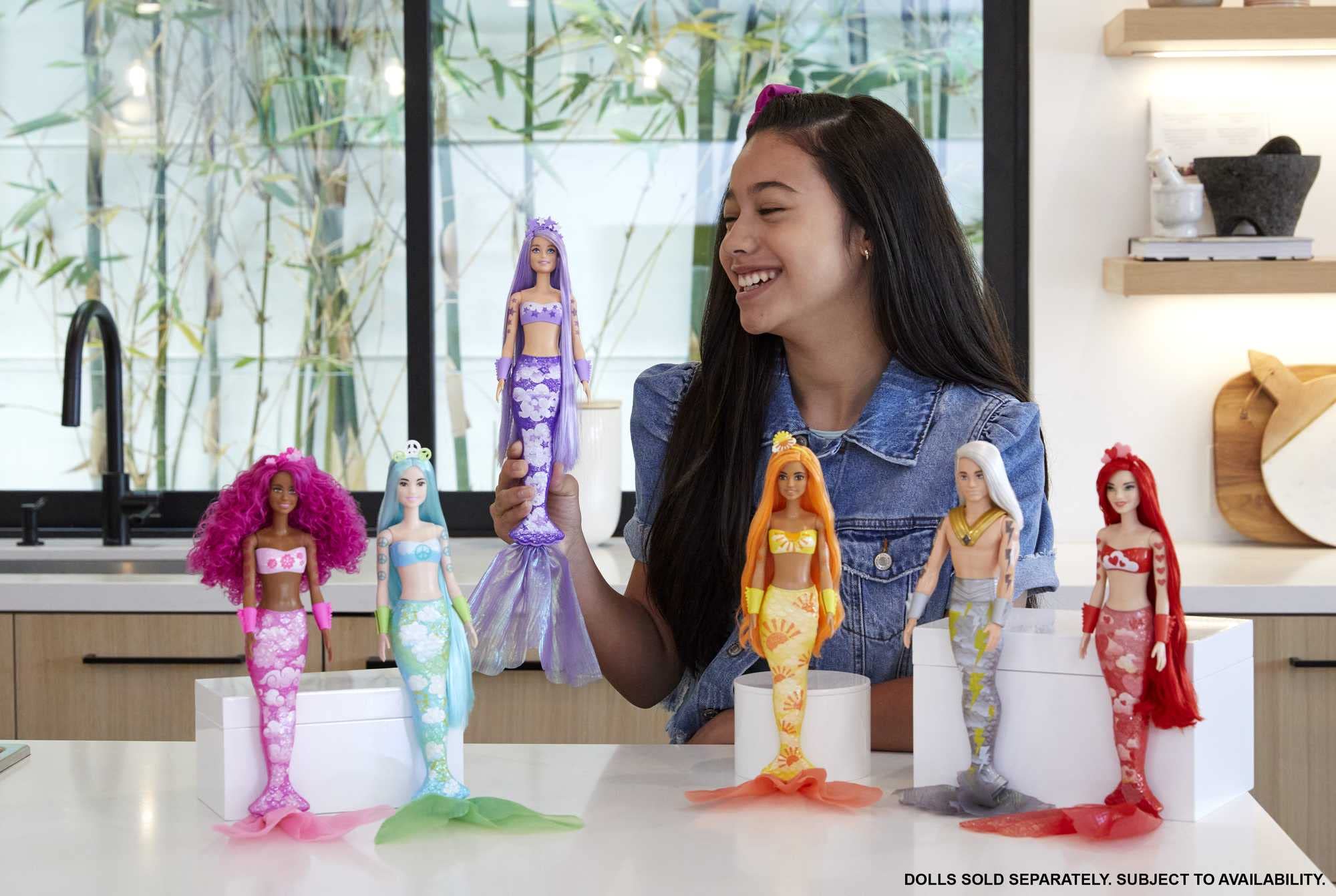 Barbie Color Reveal tube packaging shows the unboxing anticipation for kids