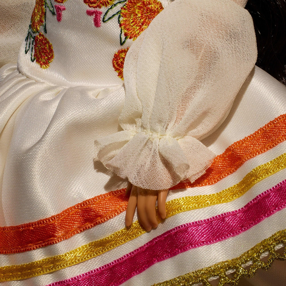 Barbie Day of the Dead 2025 doll marigold trim enhances the festive look for collectors.