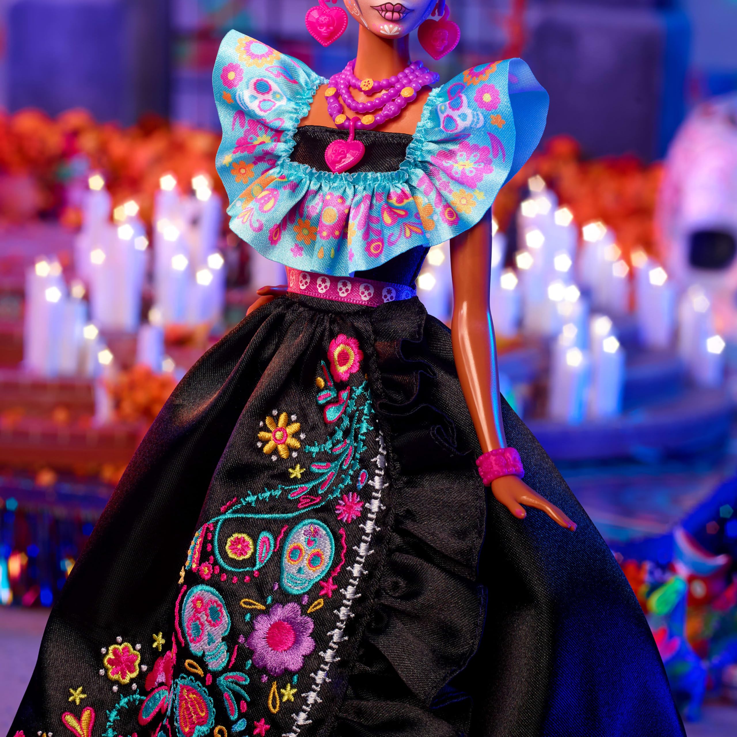 Barbie Dia de Muertos candy necklace and pink ring for playful accents.