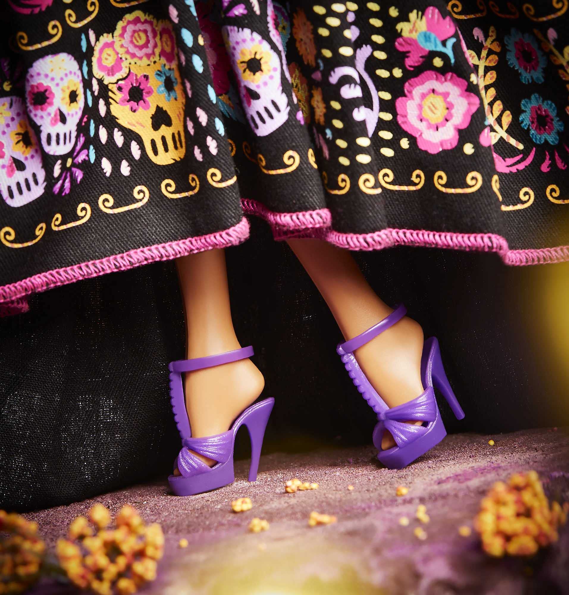 Barbie Dia De Muertos doll includes a doll stand and authenticity certificate.