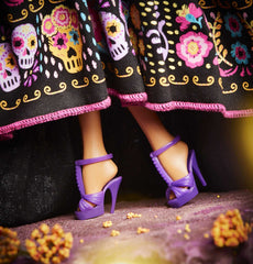 Barbie Dia De Muertos doll includes a doll stand and authenticity certificate.