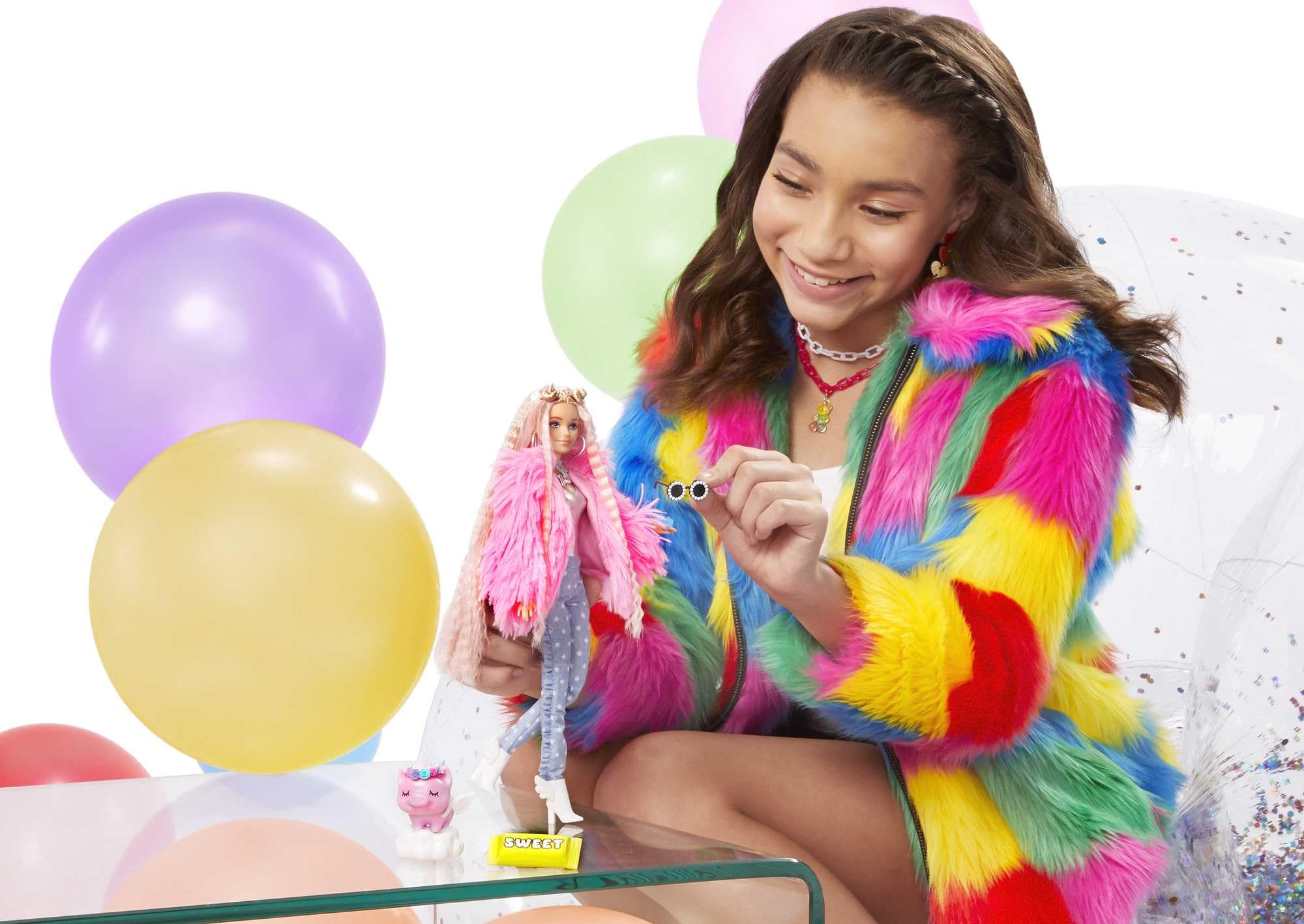 Barbie Extra doll wearing a fluffy pink coat for bold dress-up