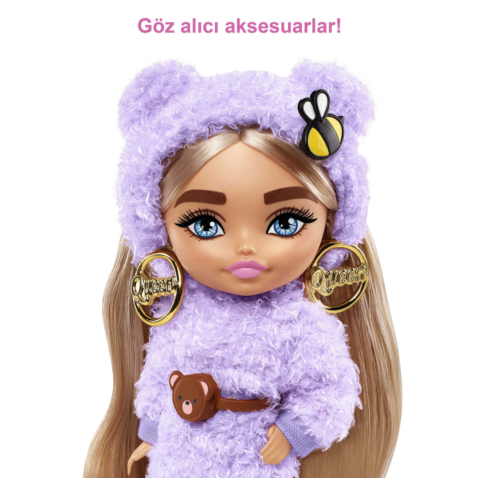 Barbie Extra Minis purple knee-high boots complete a bold outfit.