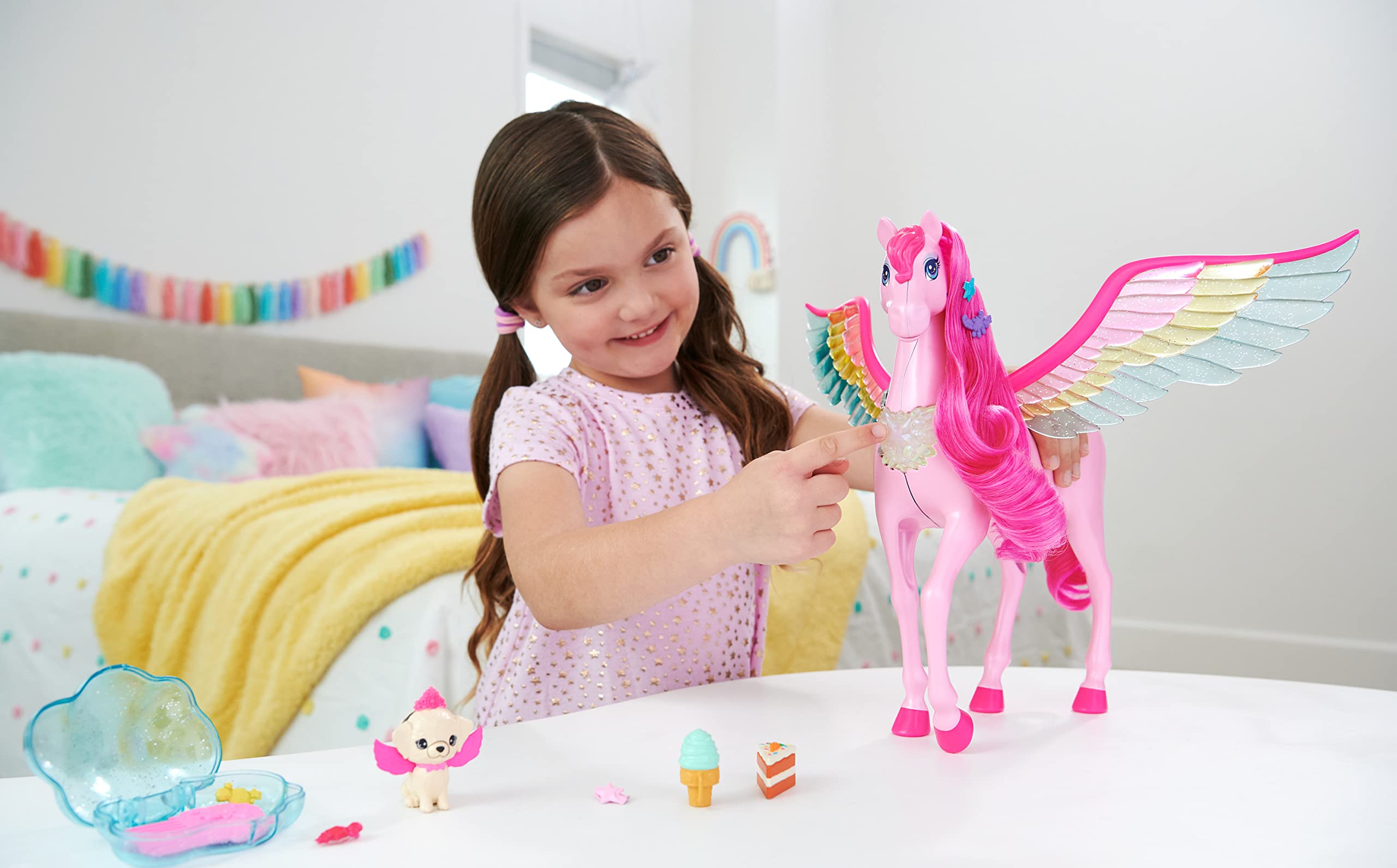 Barbie Fairytale pink Pegasus with glittery rainbow wings for magical flight-inspired play.