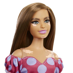 Barbie Fashionistas #171 long brunette hair frames a bold polka dot dress.