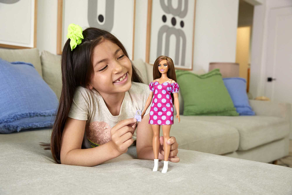 Barbie Fashionistas #171 purple purse adds style and portable storage for accessories.