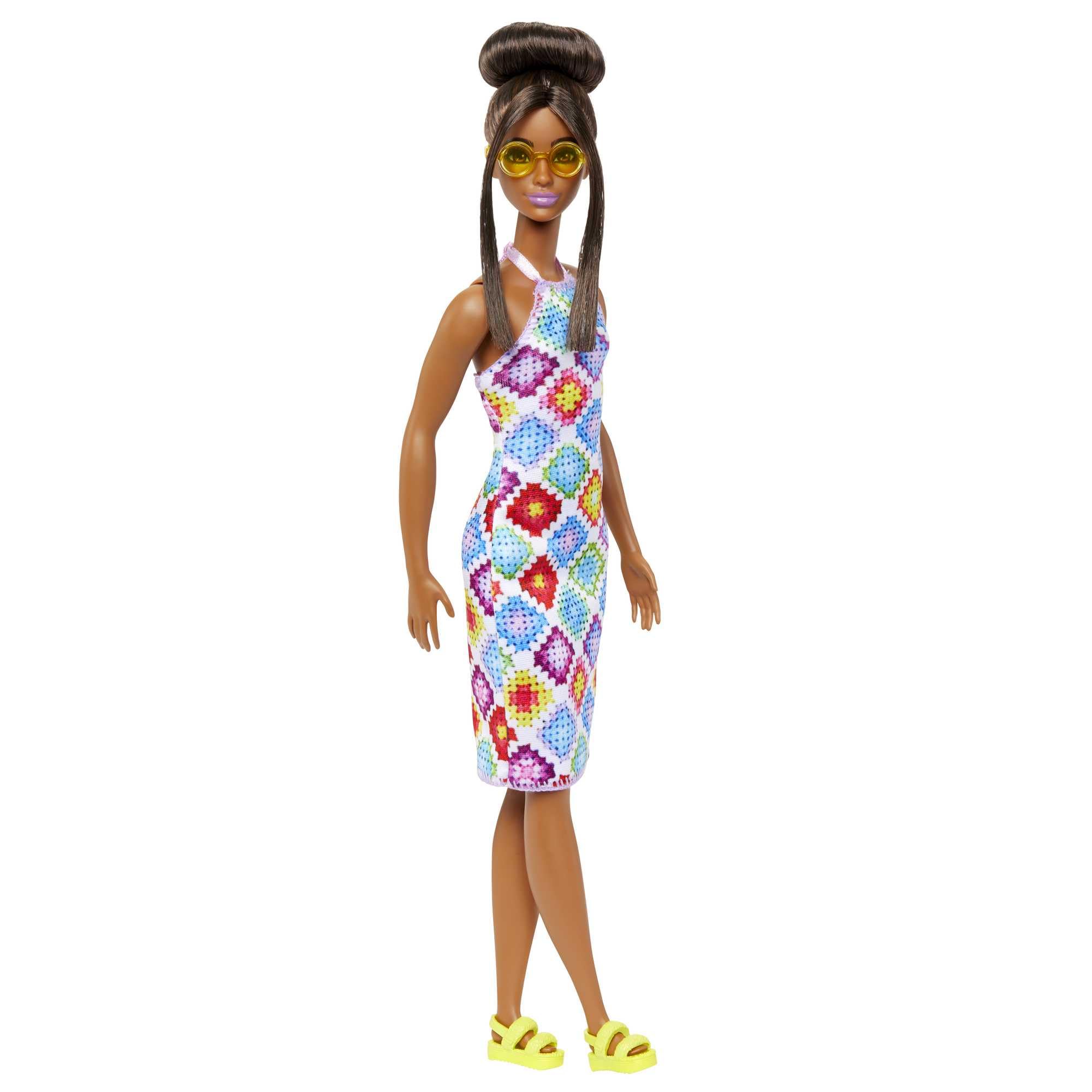 Barbie Fashionistas #210 brunette bun and sunglasses for chic travel-ready style.