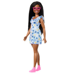 Barbie Fashionistas doll with Down syndrome wearing heart-print dress for inclusive play.