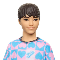 Barbie Fashionistas Ken doll peach shorts close-up shows coordinating outfits for play.