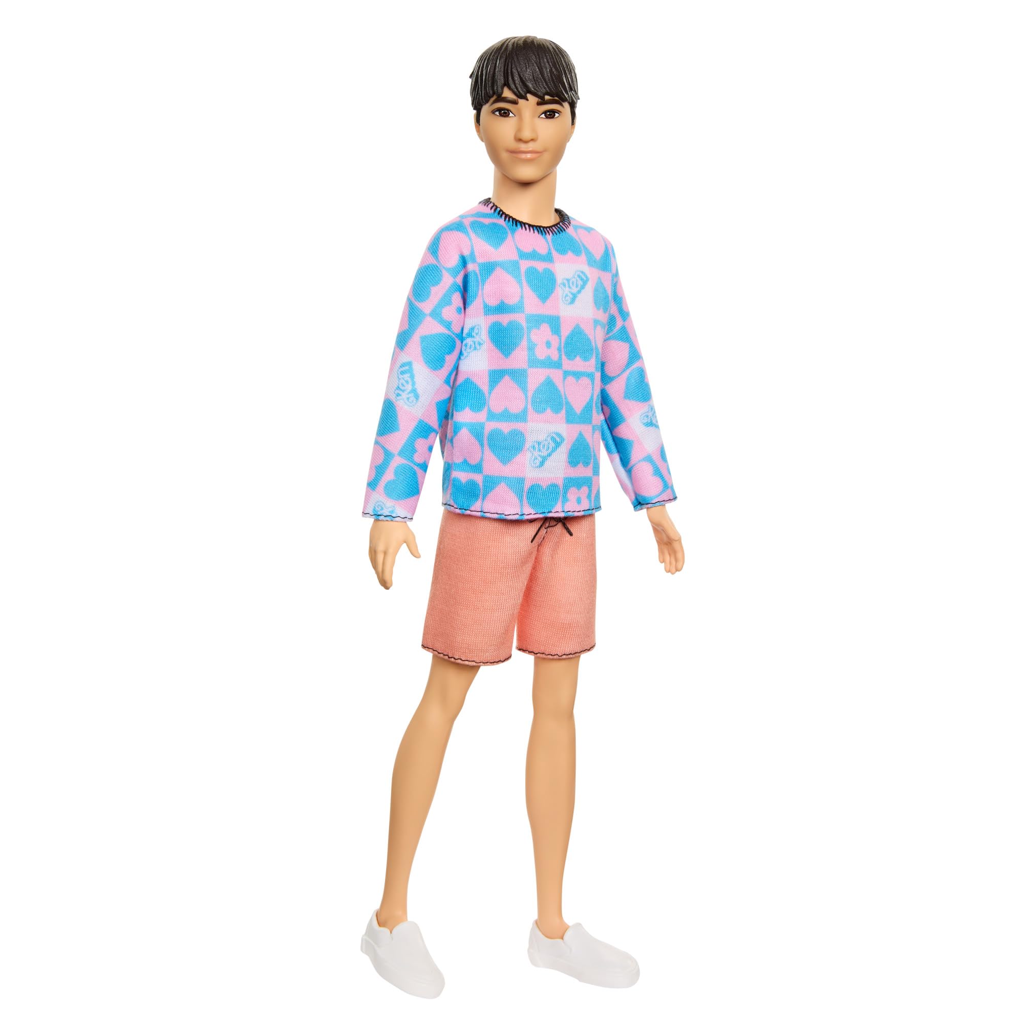 Barbie Fashionistas Ken doll slender body and black hair enable versatile styling.