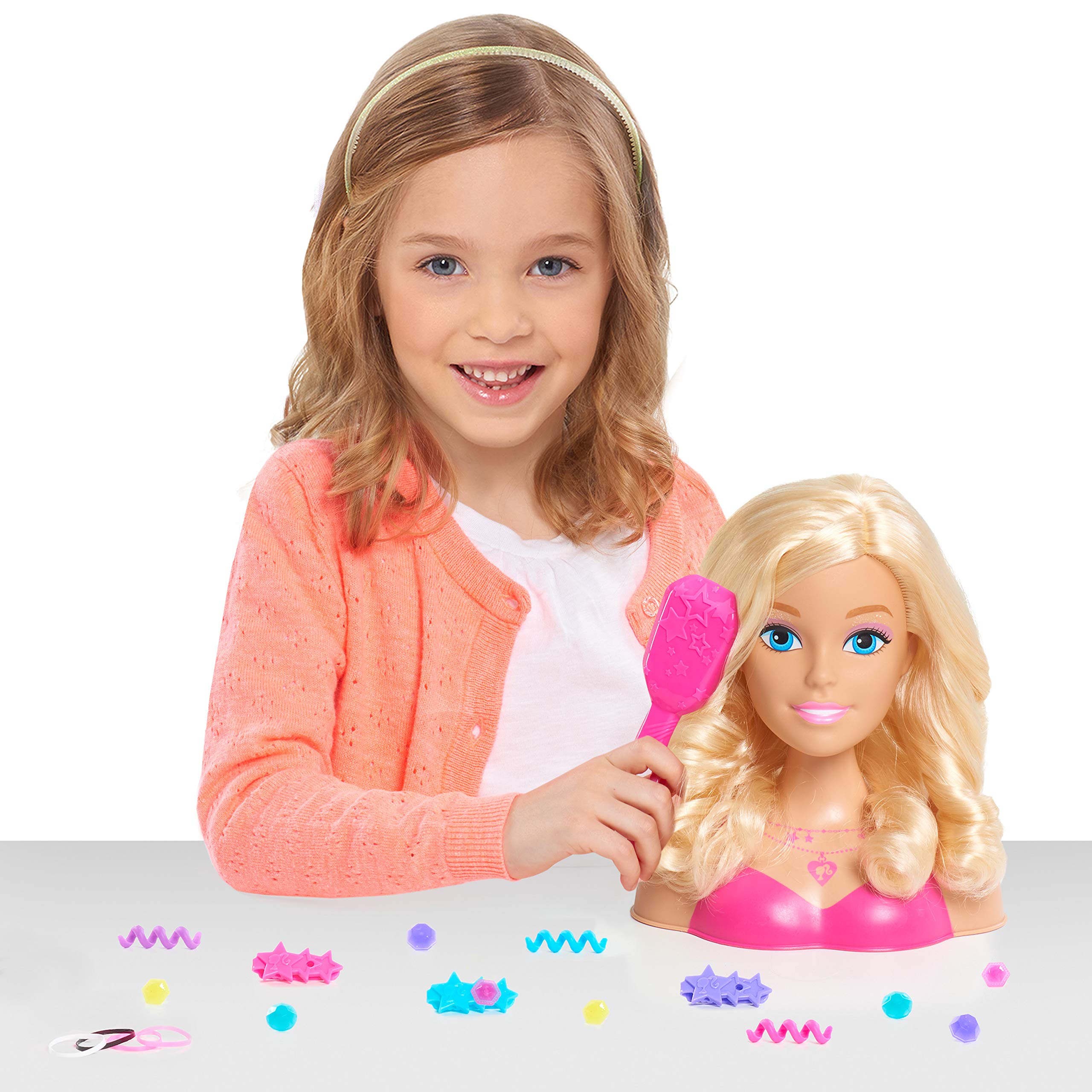 Barbie styling head with pink brush for smooth, easy hair brushing.